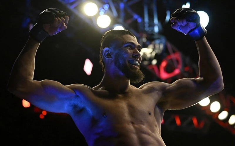 Brazilian Johnny Walker celebrates after defeating British Paul Craig during their light heavyweight bout at the Ultimate Fighting Championship (UFC) event at the Jeunesse Arena in Rio de Janeiro, Brazil, on January 21, 2023. The Ankalaev vs Walker Prediction for their UFC 294 bout is ready.