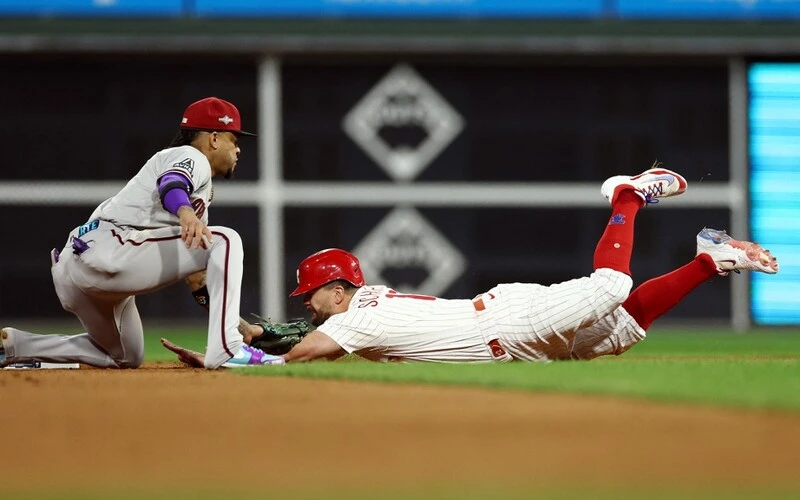 Ketel Marte #4 of the Arizona Diamondbacks tags out Kyle Schwarber #12 of the Philadelphia Phillies at second base in the seventh inning during Game Six of the Championship Series at Citizens Bank Park on October 23, 2023 in Philadelphia, Pennsylvania. The Diamondbacks vs Phillies Odds are ready for tonight's game.