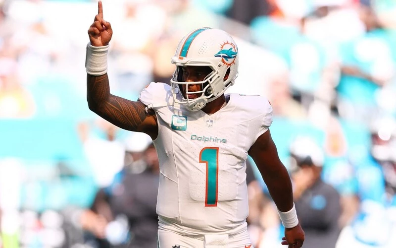 Tua Tagovailoa #1 of the Miami Dolphins reacts after a touchdown during the fourth quarter in the game against the Carolina Panthers. The Dolphins vs Eagles Odds are already set.