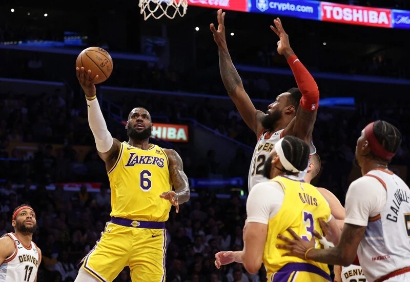 LeBron James #6 of the Los Angeles Lakers attempts a layup in front of Jeff Green #32 of the Denver Nuggets during the first quarter in game four of the Western Conference Finals. The NBA Season starts with the Lakers vs Nuggets Betting Odds.