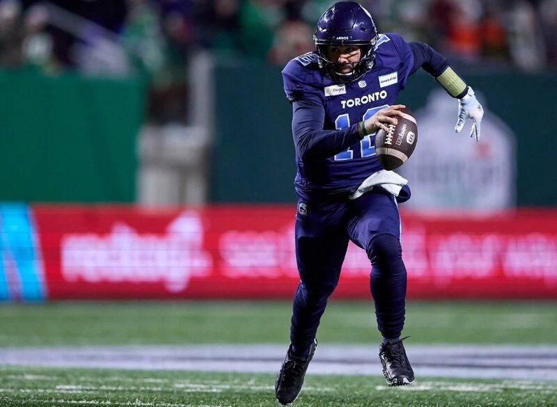 Chad Kelly #12 of the Toronto Argonauts scrambles out of the pocket in the 109th Grey Cup game between the Toronto Argonauts and Winnipeg Blue Bombers at Mosaic Stadium on November 20, 2022 in Regina, Canada. The Argonauts vs Redblacks Betting Odds are set.