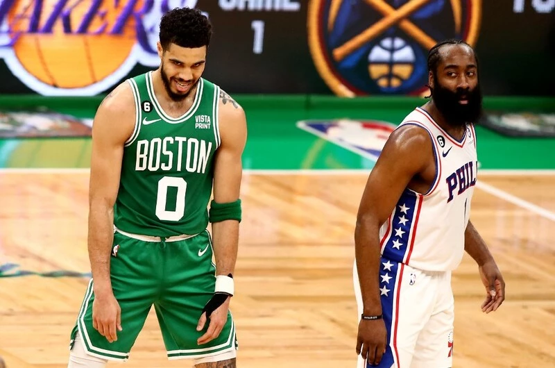 Jayson Tatum #0 of the Boston Celtics reacts against James Harden #1 of the Philadelphia 76ers during the second quarter in game seven of the 2023 NBA Playoffs Eastern Conference Semifinals at TD Garden on May 14, 2023 in Boston, Massachusetts. The Celtics vs 76ers Odds are set for to night's game.