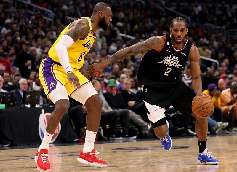 Kawhi Leonard #2 of the LA Clippers drives to the basket in front of LeBron James #6 of the Los Angeles Lakers during a 125-118 Clippers win at Crypto.com Arena on April 05, 2023 in Los Angeles, California. The Clippers vs Lakers Betting Odds are set for tonight's game.