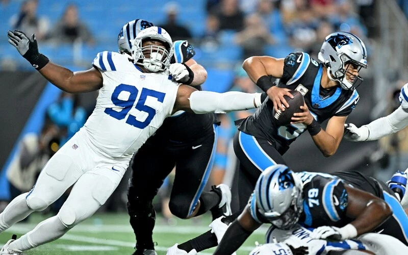 Adetomiwa Adebawore #95 of the Indianapolis Colts sacks Bryce Young #9 of the Carolina Panthers after a scramble during the fourth quarter of the game at Bank of America Stadium on November 05, 2023 in Charlotte, North Carolina. The Panthers vs Bears Week 10 Odds are set.