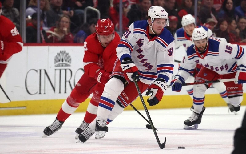 Vladimir Tarasenko #91 of the New York Rangers heads up ice while playing the Detroit Red Wings during the first period at Little Caesars Arena on February 23, 2023 in Detroit, Michigan. The Red Wings vs Rangers Betting Odds are set.