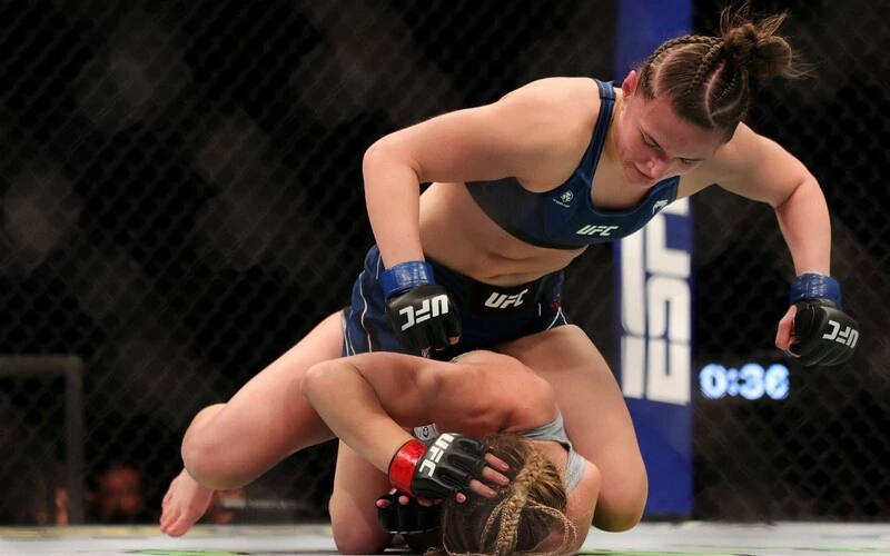 Blanchfield vs Fiorot Betting: Erin Blanchfield (top) strikes Miranda Maverick in their women's flyweight fight during the UFC 269 event at T-Mobile Arena on December 11, 2021 in Las Vegas, Nevada. Carmen Mandato/Getty Images/AFP