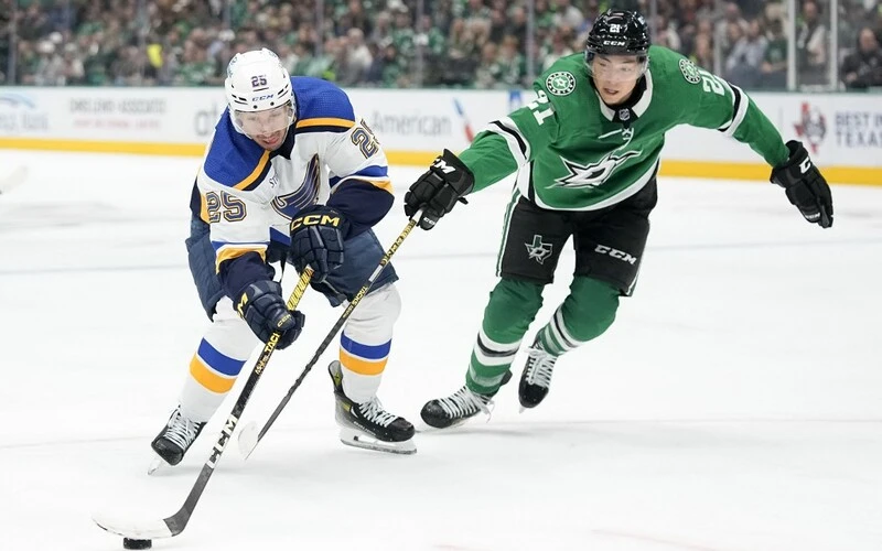 Blues vs Stars Predictions> Jordan Kyrou #25 of the St. Louis Blues controls the puck against Jason Robertson #21 of the Dallas Stars in the second period of their season opener at American Airlines Center on October 12, 2023 in Dallas, Texas. Sam Hodde/Getty Images/AFP
