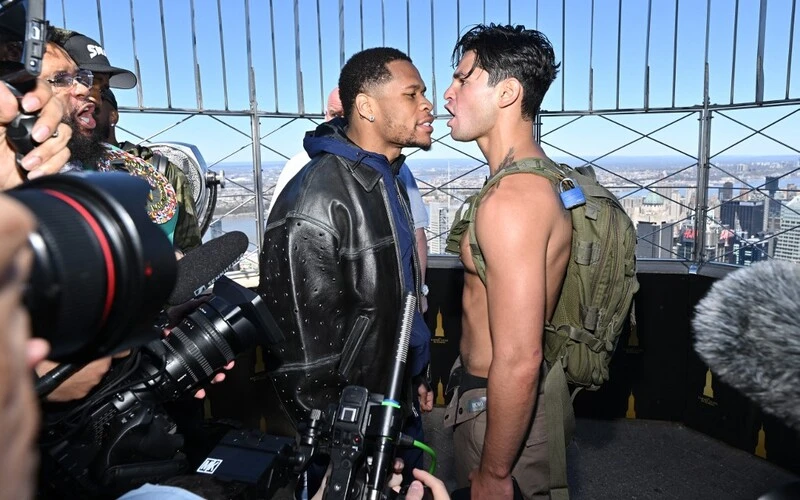 Haney vs Garcia Prediction: Devin Haney and Ryan Garcia face-off at The Empire State Building on April 16, 2024 in New York City. Roy Rochlin/Getty Images for Empire State Realty Trust/AFP