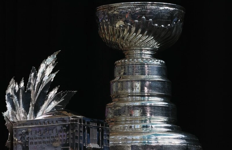 Stanley Cup Playoffs Odds: The Conn Smythe Trophy and the Stanley Cup are on display during the 2022 NHL Stanley Cup Final Media Day at Ball Arena on June 14, 2022 in Denver, Colorado. Bruce Bennett/Getty Images/AFP
